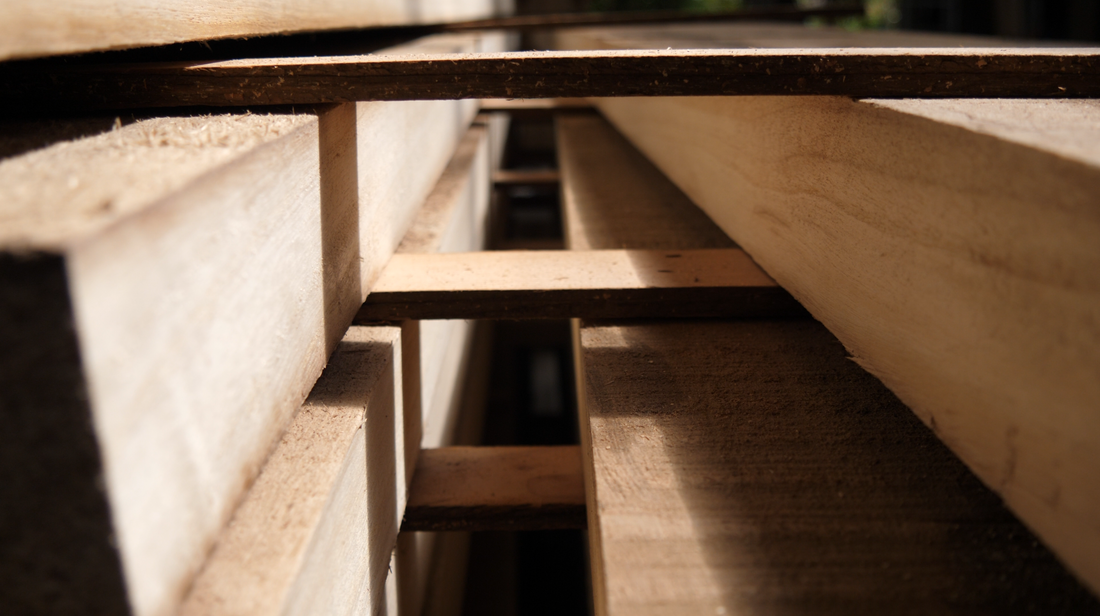 Stacked Paulownia planks in the Sine Surf workshop in Sydney