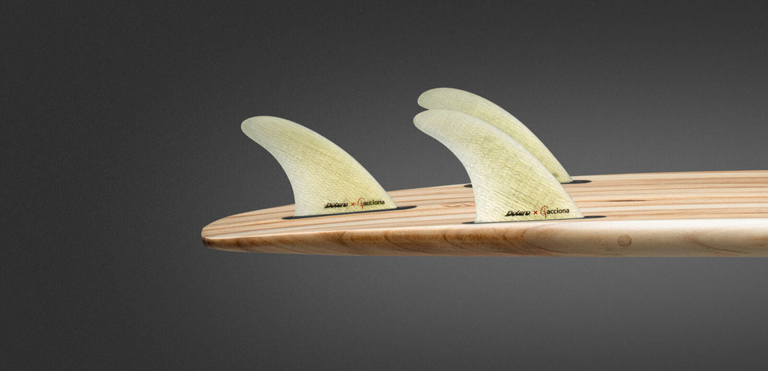 Bolero x Acciona Turbine Made fins, machined from recycled wind turbine blade, on a wooden surfboard